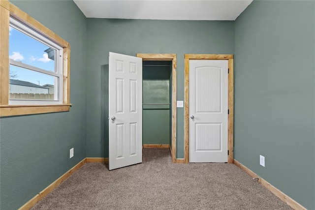 106 N Dewey St, Corn, OK 73024 - unfurnished bedroom with baseboards, a closet, and carpet floors