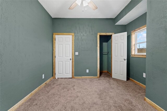 106 N Dewey St, Corn, OK 73024 - unfurnished bedroom with baseboards, ceiling fan, a closet, and carpet floors