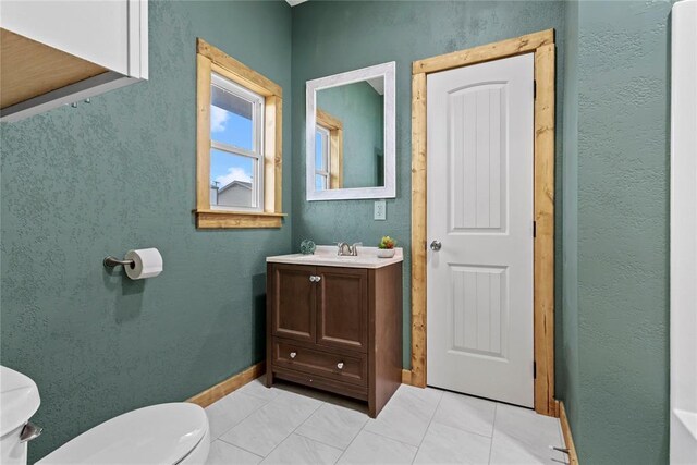 106 N Dewey St, Corn, OK 73024 - bathroom featuring toilet, vanity, and tile patterned floors