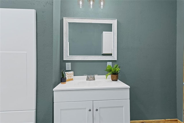 106 N Dewey St, Corn, OK 73024 - bathroom with vanity and a textured wall