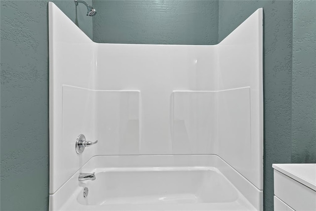 106 N Dewey St, Corn, OK 73024 - full bath featuring shower / washtub combination, vanity, and a textured wall
