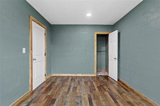 106 N Dewey St, Corn, OK 73024 - unfurnished room with a textured wall, baseboards, and wood finished floors