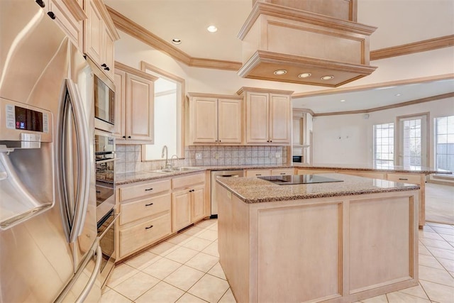 kitchen featuring light tile patterned floors, premium range hood, appliances with stainless steel finishes, light brown cabinetry, and tasteful backsplash