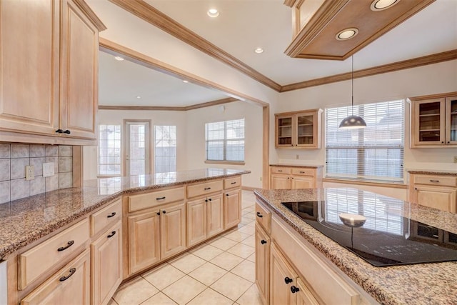 kitchen with tasteful backsplash, glass insert cabinets, black electric cooktop, crown molding, and light brown cabinets