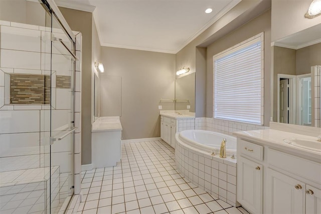 bathroom with a garden tub, two vanities, ornamental molding, a shower stall, and tile patterned floors