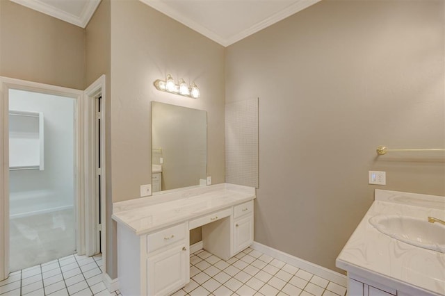 bathroom with ornamental molding, tile patterned flooring, vanity, and baseboards