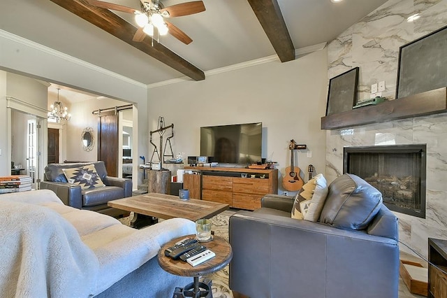 living area featuring ornamental molding, a fireplace, beam ceiling, and a ceiling fan