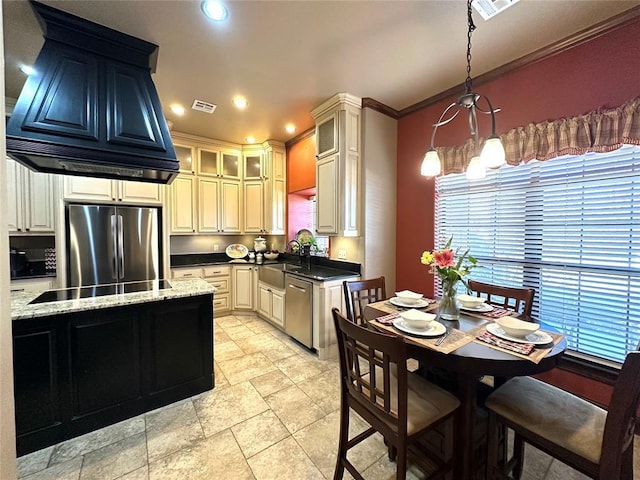 kitchen featuring recessed lighting, stainless steel appliances, a sink, visible vents, and glass insert cabinets