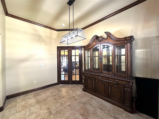 foyer featuring ornamental molding, french doors, and baseboards