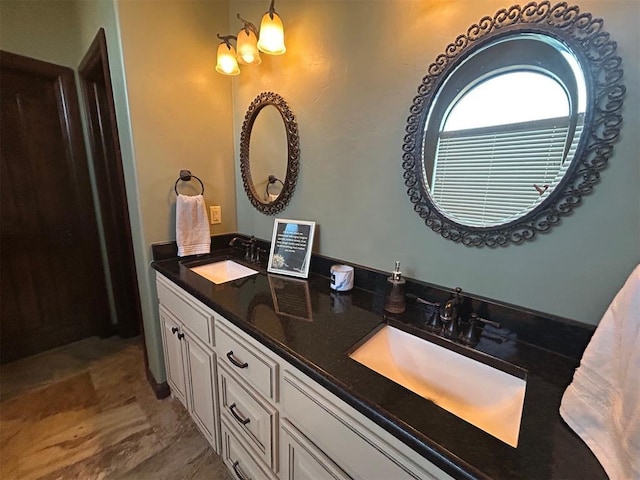 bathroom with a sink and double vanity