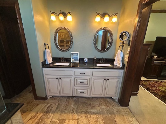 bathroom featuring double vanity and a sink