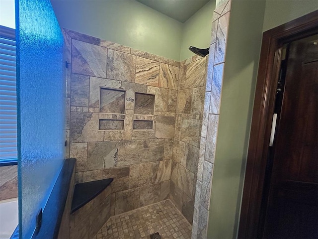 full bathroom with tiled shower