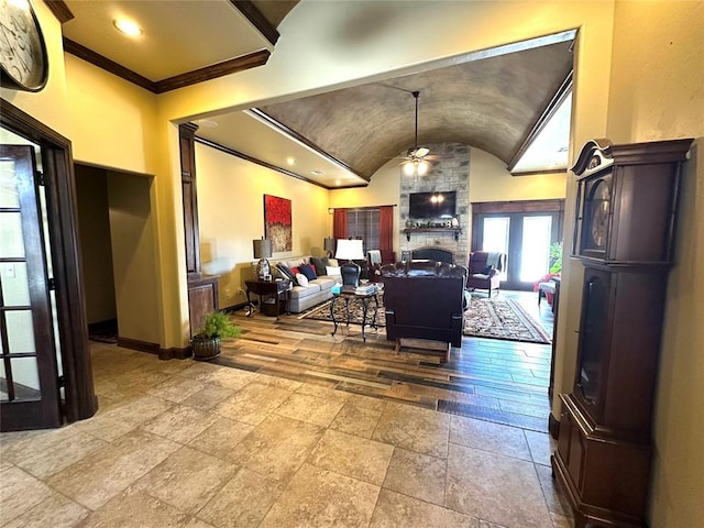 living room featuring a fireplace, recessed lighting, vaulted ceiling, ceiling fan, and baseboards