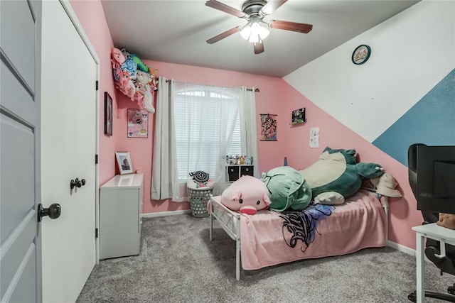 carpeted bedroom with a ceiling fan, vaulted ceiling, and baseboards