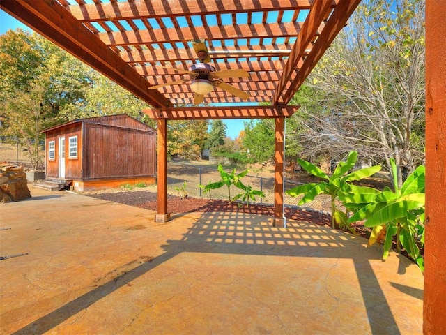 view of patio / terrace featuring an outdoor structure, a storage shed, and a pergola