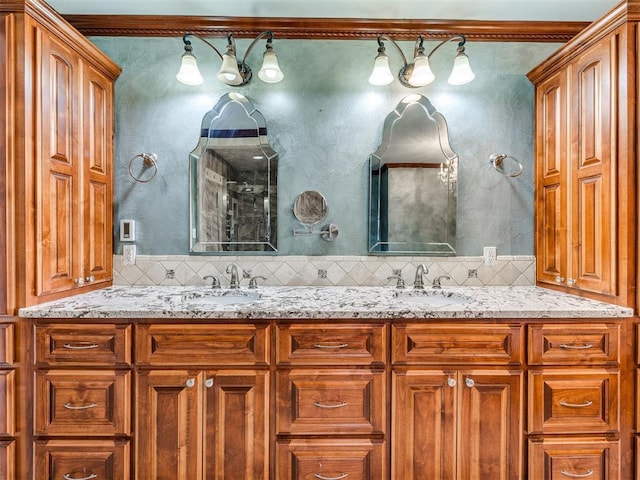 full bath featuring a sink, backsplash, and double vanity