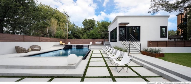 view of swimming pool featuring a fenced backyard