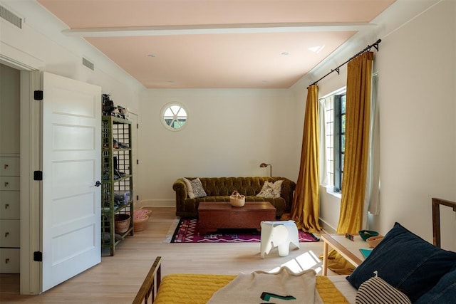 sitting room with light wood finished floors and baseboards