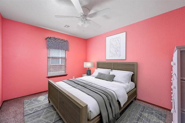 bedroom with carpet, visible vents, ceiling fan, and baseboards