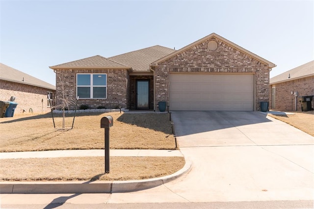 ranch-style house featuring a garage, driveway, roof with shingles, and brick siding