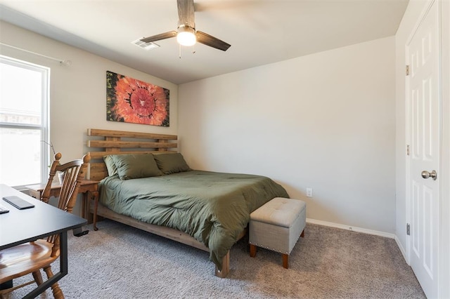 bedroom with ceiling fan, carpet floors, visible vents, and baseboards