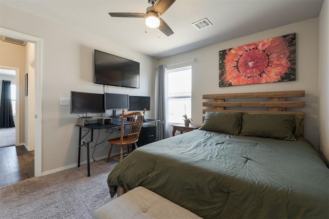 carpeted bedroom with ceiling fan, visible vents, and baseboards