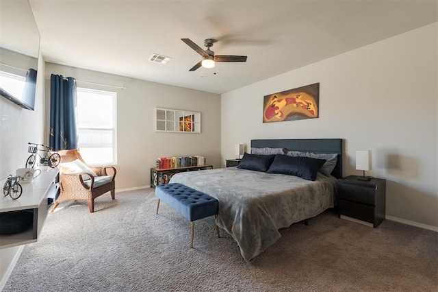 carpeted bedroom featuring baseboards, visible vents, and ceiling fan