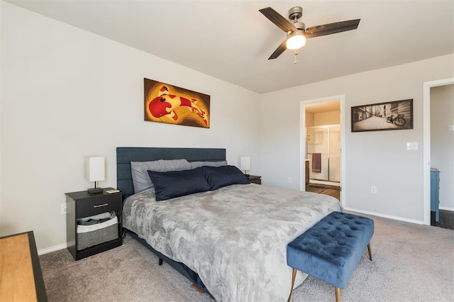 bedroom with ceiling fan, carpet floors, connected bathroom, and baseboards