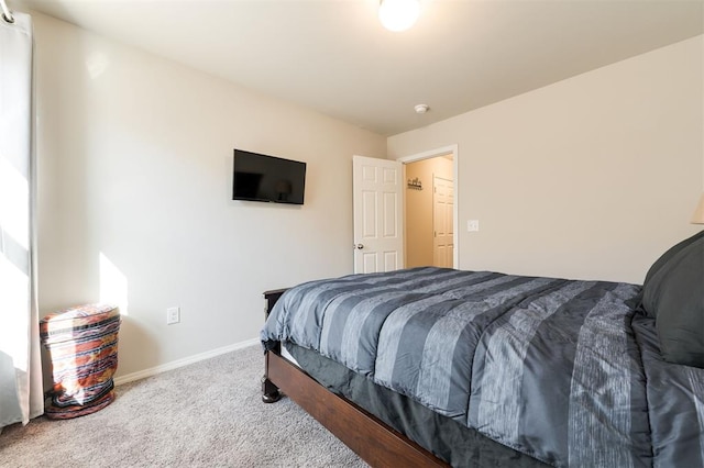 bedroom with carpet flooring and baseboards