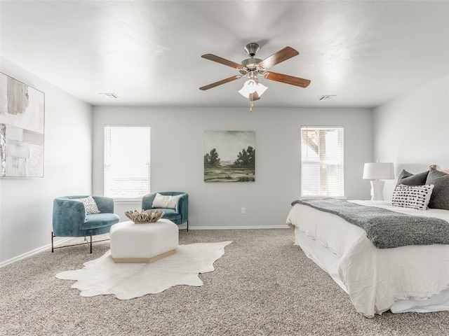 carpeted bedroom with ceiling fan, visible vents, and baseboards