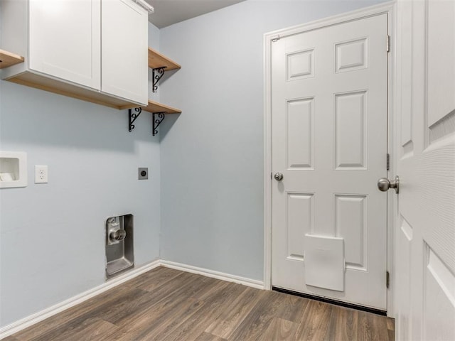 laundry area featuring dark wood-style flooring, cabinet space, electric dryer hookup, and baseboards