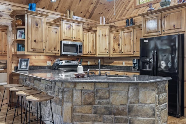 kitchen featuring light wood-style flooring, stainless steel appliances, wood ceiling, open shelves, and a kitchen bar