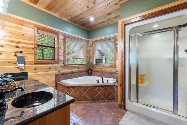 full bathroom featuring a garden tub, a sink, a shower stall, tile patterned flooring, and wooden ceiling