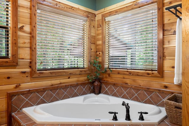 full bathroom featuring a wealth of natural light and a garden tub