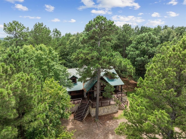 drone / aerial view featuring a forest view