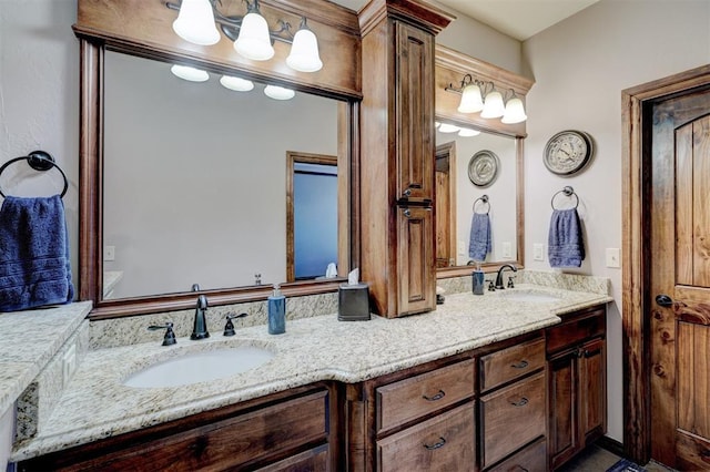 full bath featuring double vanity and a sink