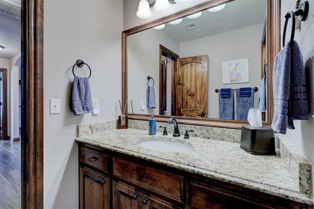 bathroom featuring visible vents and vanity