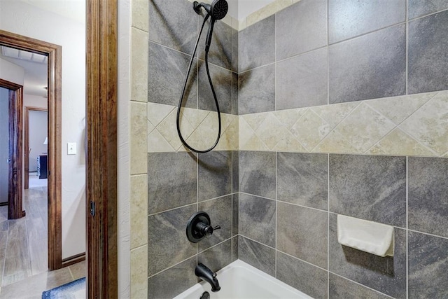 details featuring shower / bathtub combination