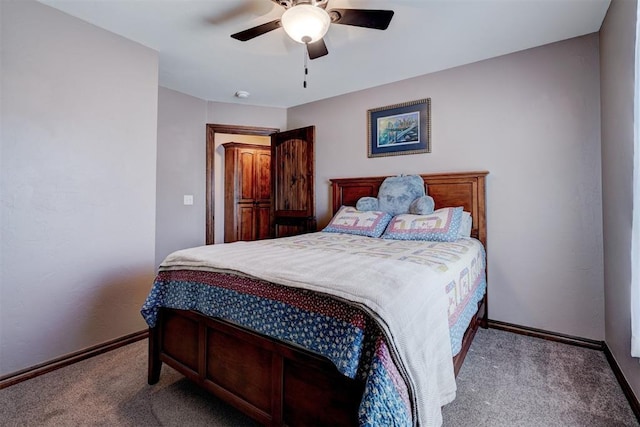 carpeted bedroom featuring ceiling fan and baseboards