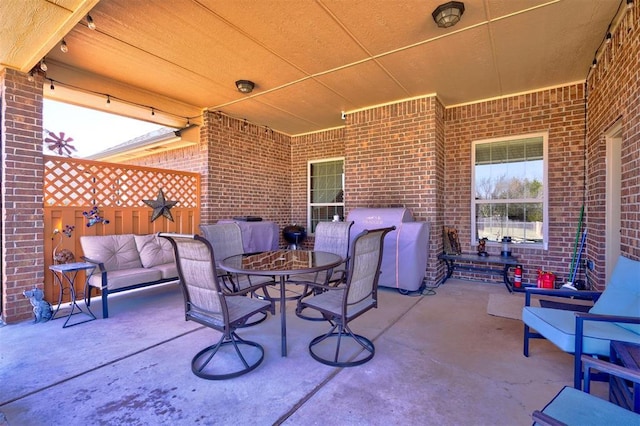 view of patio / terrace with outdoor dining space, grilling area, and an outdoor hangout area