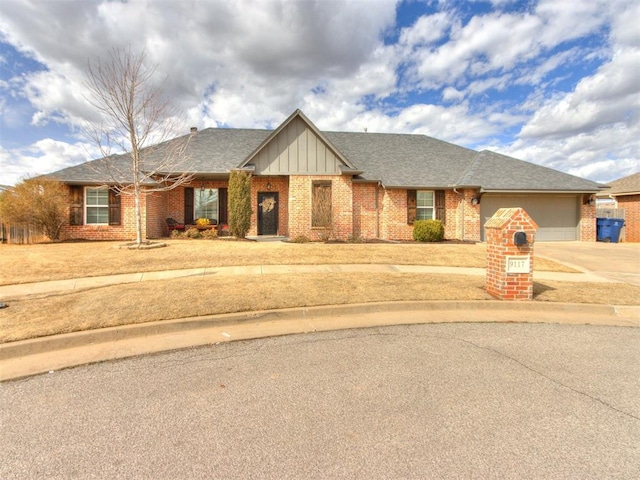 view of front of home featuring brick siding, a shingled roof, an attached garage, board and batten siding, and driveway