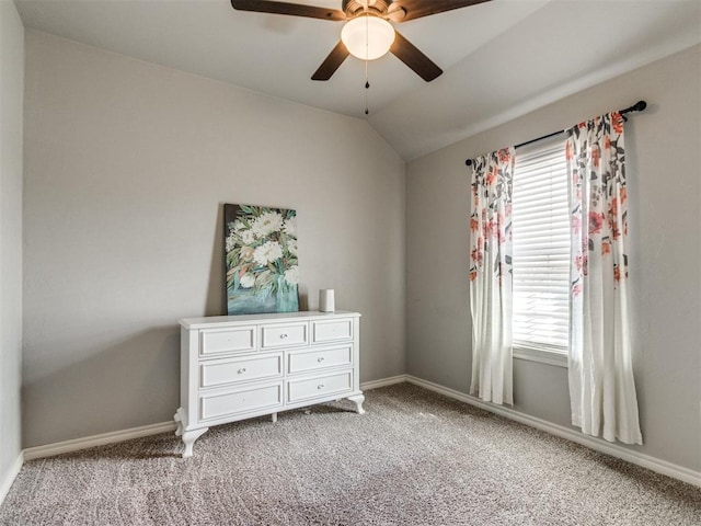 bedroom featuring lofted ceiling, light carpet, and baseboards