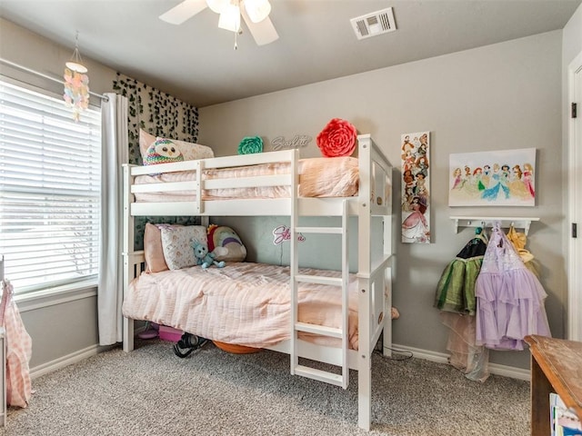 bedroom with a ceiling fan, carpet, visible vents, and baseboards