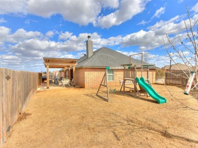 view of play area with a patio area, a fenced backyard, and a pergola