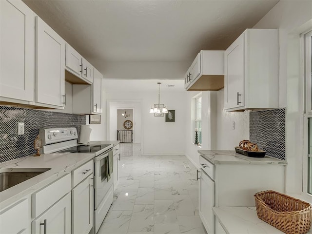 kitchen featuring white electric stove, baseboards, white cabinets, marble finish floor, and light stone countertops