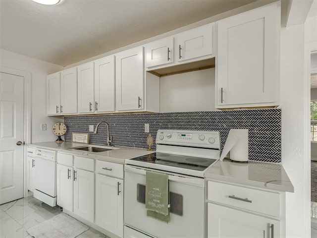 kitchen featuring marble finish floor, white appliances, a sink, and light countertops