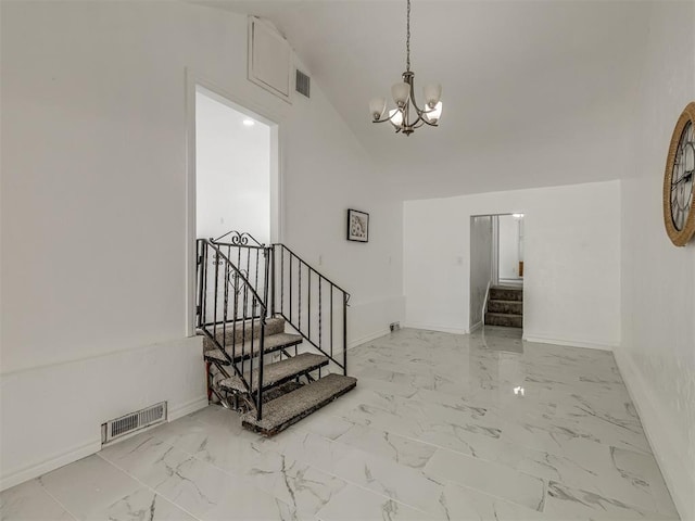 foyer entrance with baseboards, visible vents, lofted ceiling, stairway, and marble finish floor