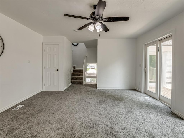 unfurnished bedroom with baseboards, visible vents, ceiling fan, access to exterior, and carpet flooring