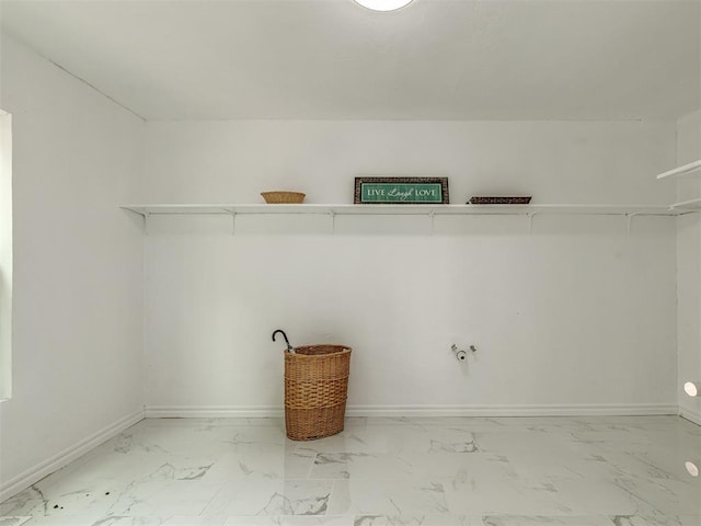 spacious closet featuring marble finish floor