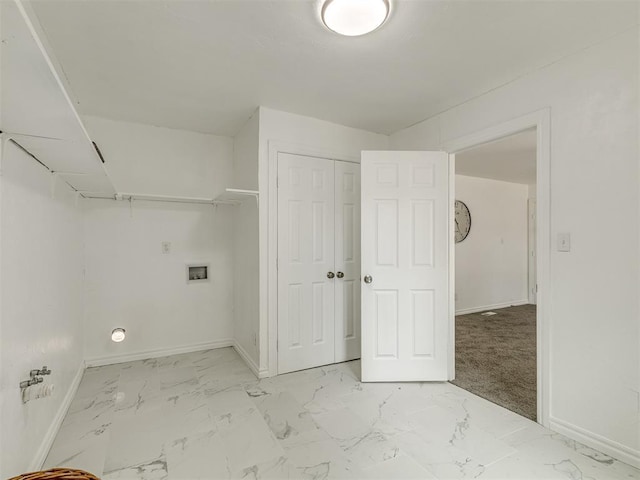 laundry room featuring hookup for a washing machine, laundry area, marble finish floor, and baseboards